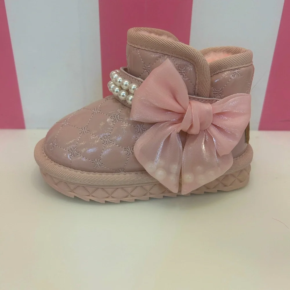 Pearl strapped quilted boots